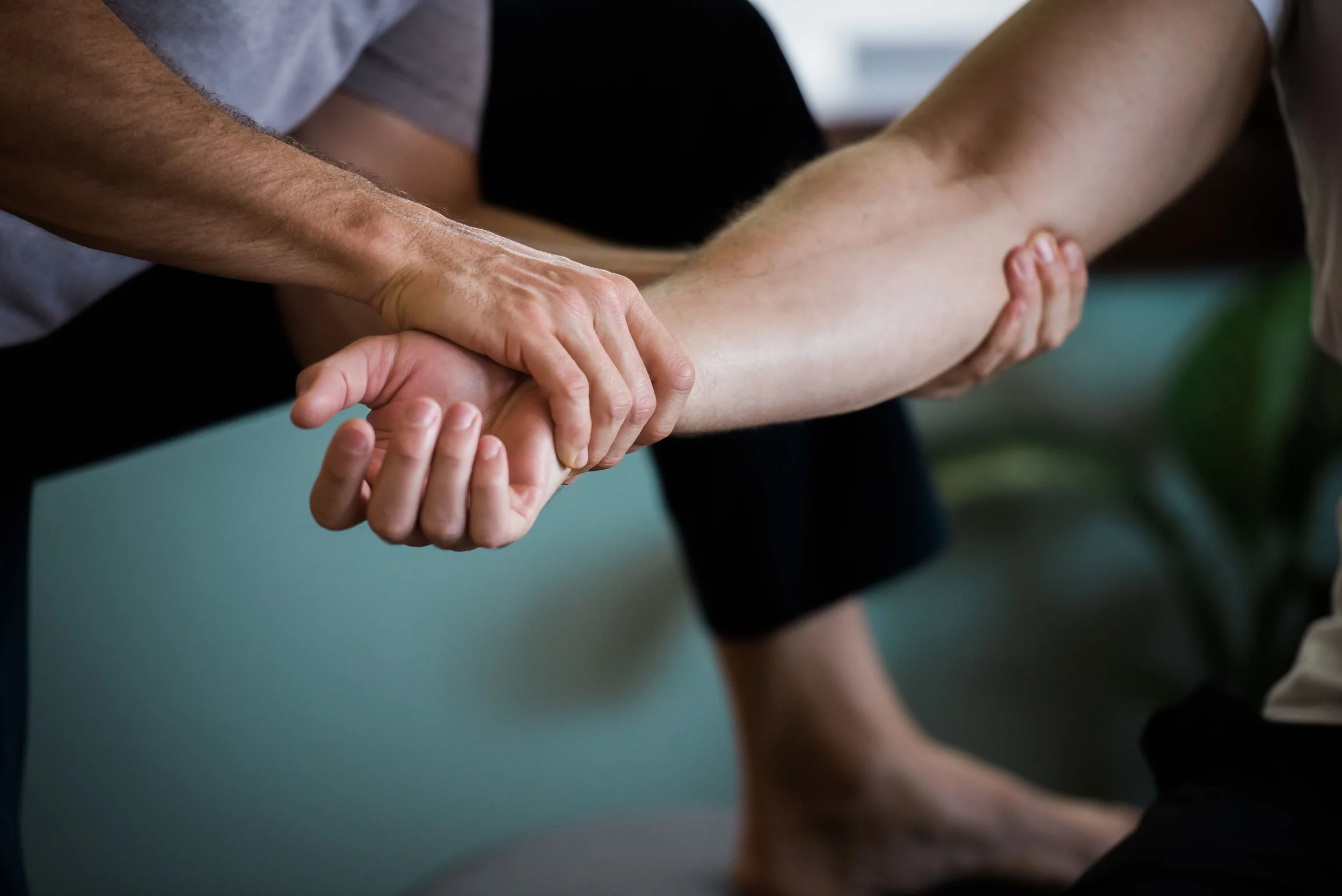 Close-up of Dr. Dylan performing precise arm and wrist adjustment